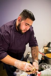 Chef Pedro Ortiz plating up his food.