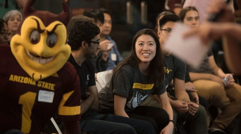 People in an audience watching a pitch competition at ASU