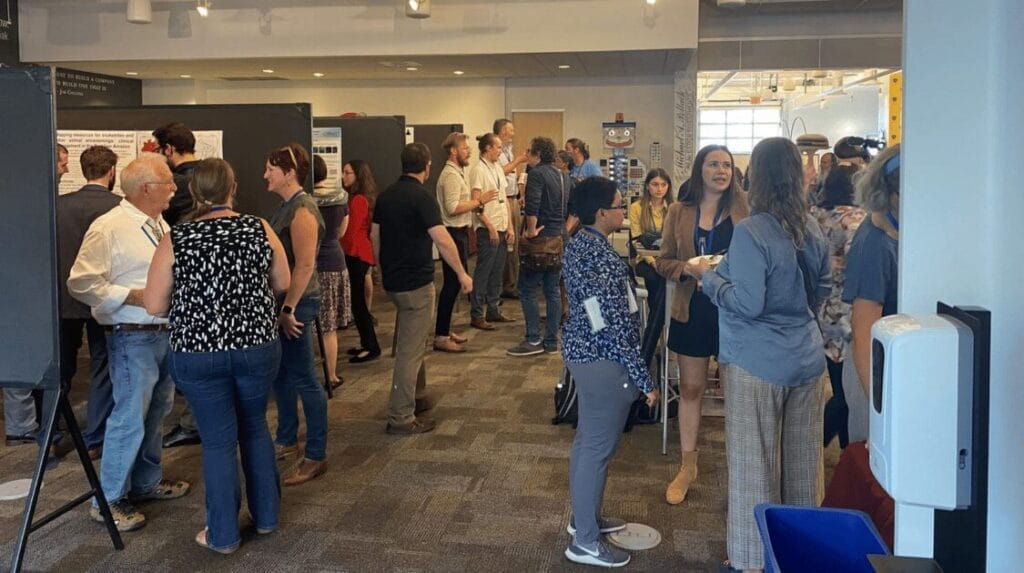 people standing at an event talking and networking