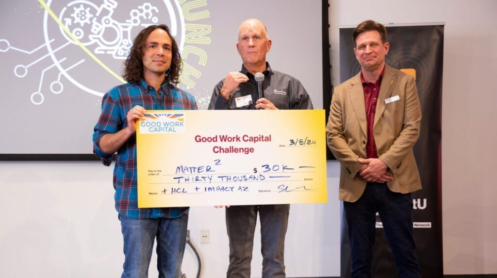 Three people holding a large check at ASU’s Lab to LAunch event