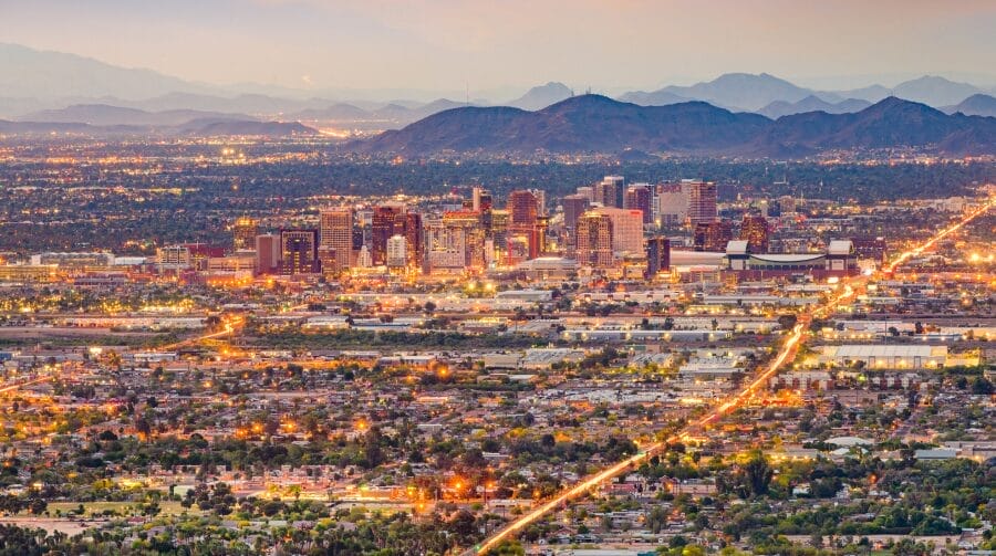 An evening view of Downtown Phoenix, Arizona with lights sprinkled across the photo