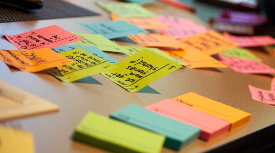 Colorful sticky notes scattered across a table