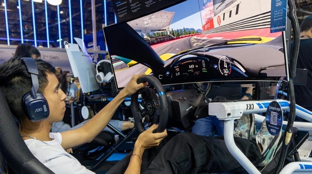 A person sitting in a race car simulator