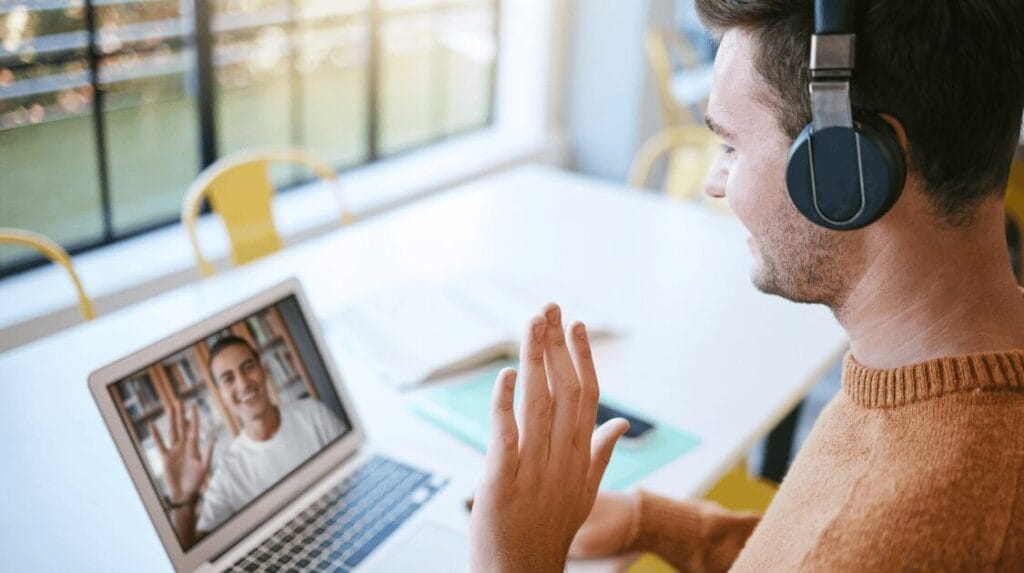 A startup founder presenting to a person on their laptop screen in a virtual meeting.
