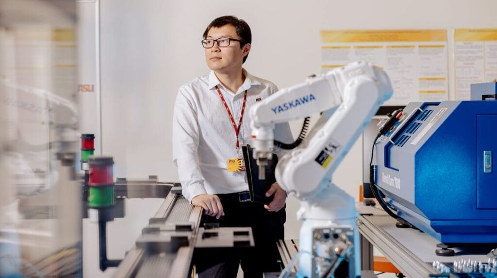 A person standing in a laboratory at Arizona State University.
