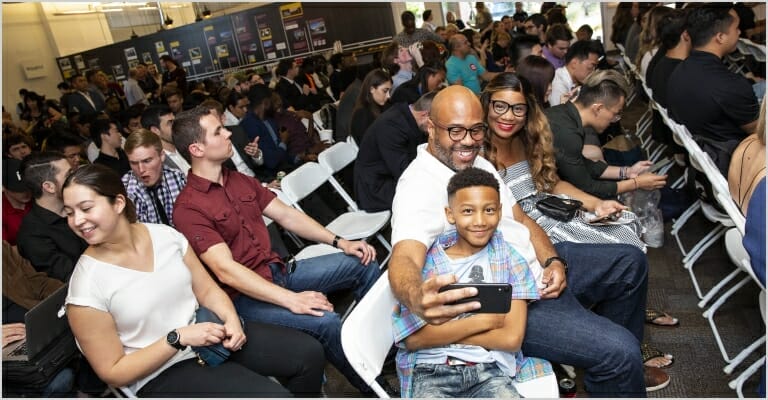 Child taking selfie with family or friends