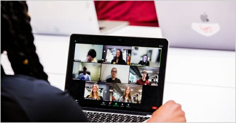 person staring at computer in an online meeting