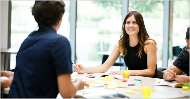 group discussing ideas at a table