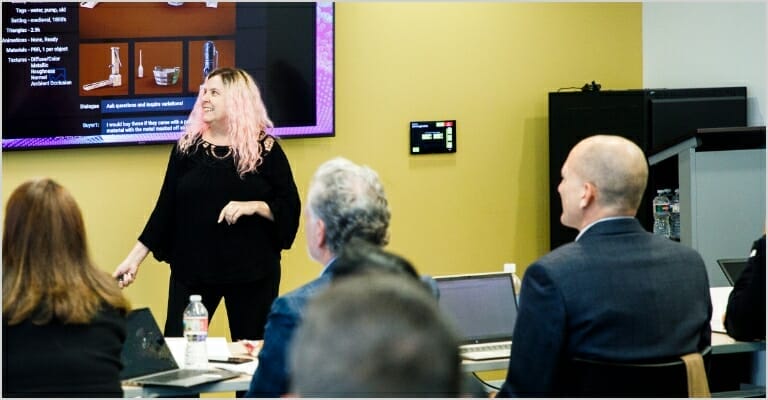 lady giving presentation to people