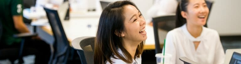 Two students laugh during a that was part of the Poder program.